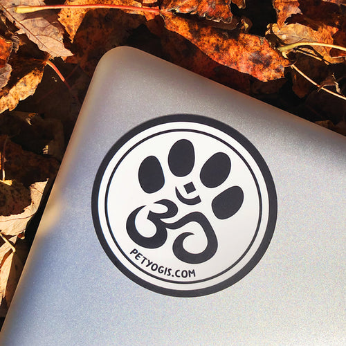 Pet Yogis circle sticker on macbook